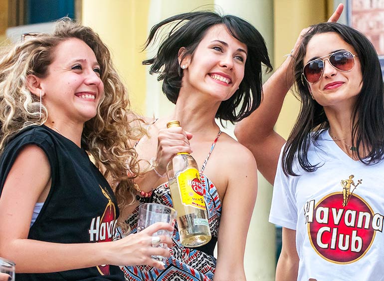 Cuban girls sample Havana Club rum.