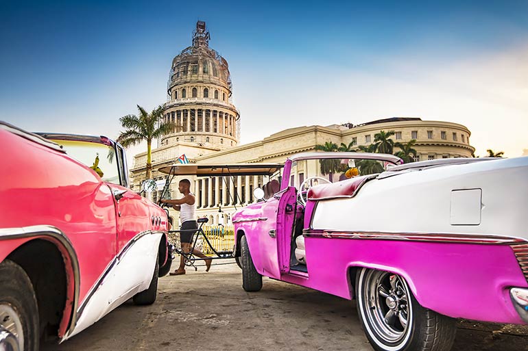 Havana’s capitol and old cars.