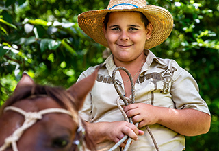 Boy riding horse in Viñales Cuba.
