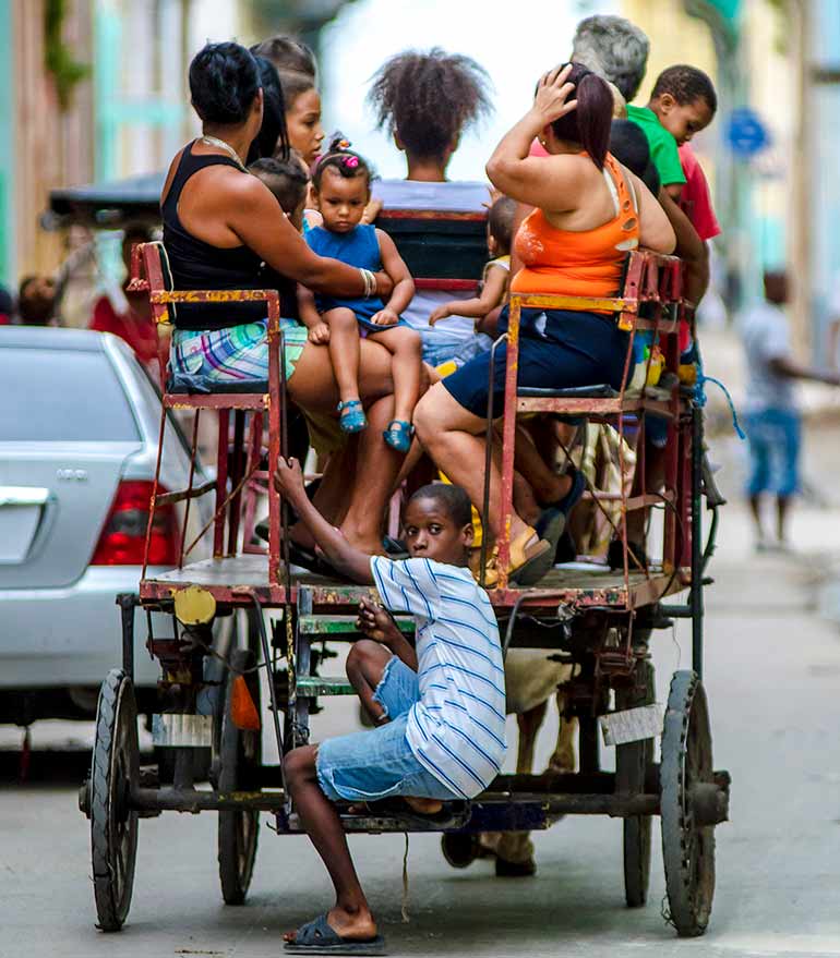 Cubans in horse-drawn cart.